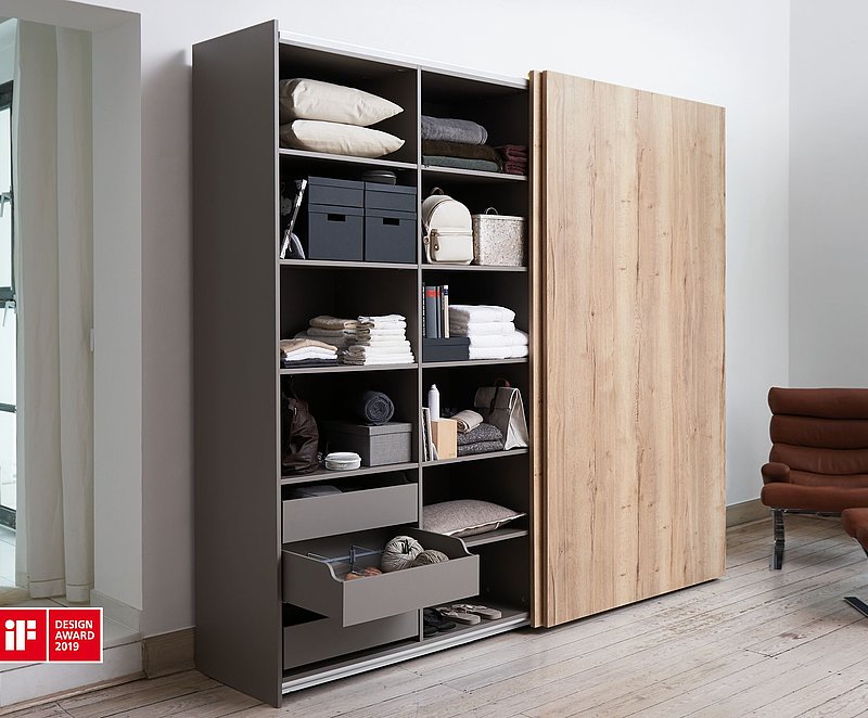 Awarded for outstanding design: with its extremely shallow design, the TopLine XL sliding door fitting blends into the design of furniture where it can hardly be seen. Photo: Hettich
