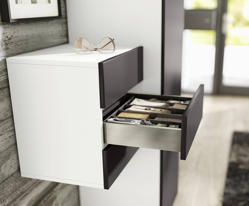 Freedom in choosing materials: the AvanTech YOU system features inlays to meet personal design preferences. Whether in glass or other materials – almost anything is possible. Photo: Hettich